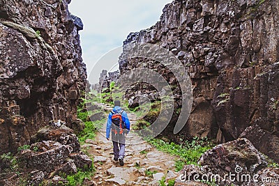 Hiking in rocky canyon, backpacker Stock Photo