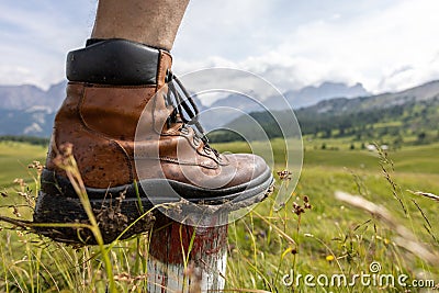 Hiking shoe in front of a mountain panorama Stock Photo