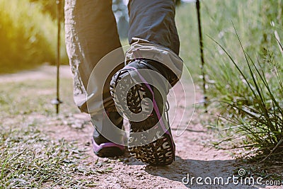 Hiking shoes woman in beautiful rock trail,Hiker trekking or walking at nature,Close up Stock Photo