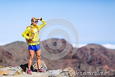 Hiking success, happy woman backpacker climbing in mountains Stock Photo