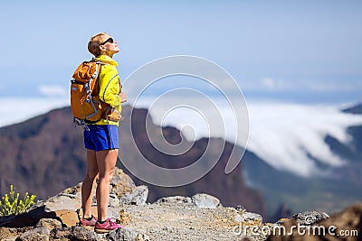 Hiking success, happy woman in mountains Stock Photo