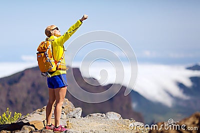 Hiking success, happy woman in mountains Stock Photo