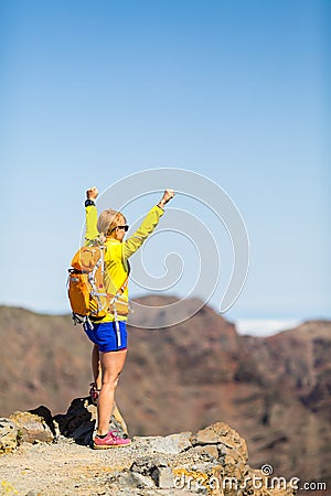 Hiking success, happy woman in mountains Stock Photo