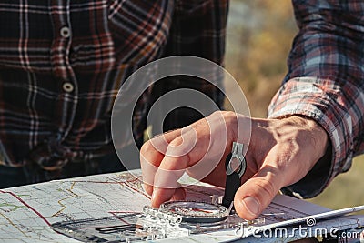 Hiking tourism hobby travelers compass map Stock Photo