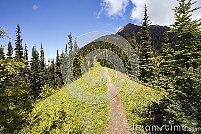 Hiking trail heads up a steep mountain ridge Stock Photo