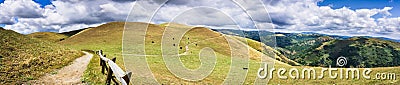 Hiking trail through the hills of south San Francisco bay area; cattle grazing on the hillsides; San Jose, California Stock Photo