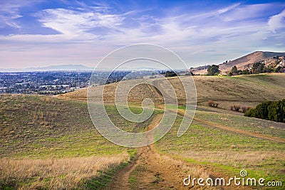 Hiking trail over the hills of Garin Dry Creek Pioneer Regional Park at sunset Stock Photo