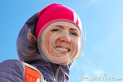 Portrait of young woman winter clothing and standing on mountain and smiling at camera. Woman in warm clothing with Stock Photo