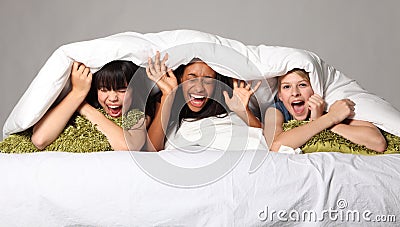 Hilarious laughter fun at teenage slumber party Stock Photo