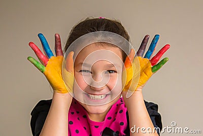 Hild with colorful painted palms and hands with color paints Stock Photo