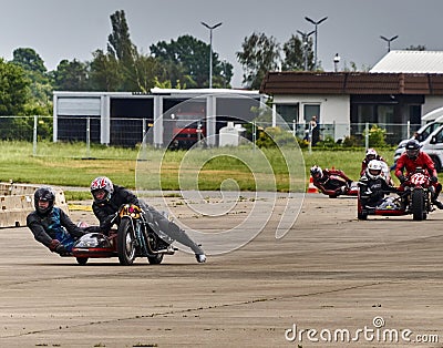 Classic motorcycles with sidecars during the race on an asphalt track, selctive focus Editorial Stock Photo