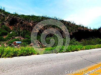A hill with a cave Stock Photo