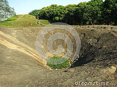 The bomb crater at A1 Hill in Dien Bien Phu, VIETNAM, which was an important battlefield during the Battle of Dien Bien Phu Stock Photo