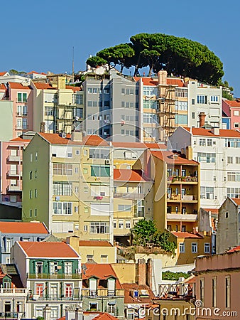 Typical apartment building in pastel colors on a big hill with viewpoint in Lisbon, Portugal Editorial Stock Photo