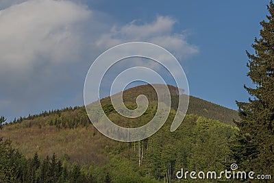 Hills over Trojanovice village in spring sunny color evening Stock Photo