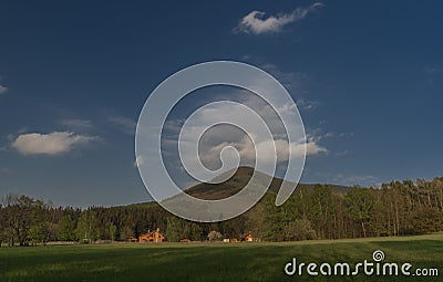 Hills over Trojanovice village in spring sunny color evening Stock Photo