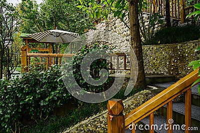Hillside stairway and sunshade in autumn morning after rain Stock Photo
