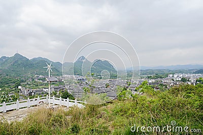 Hilltop balustraded platform overlooking Qingyan town in cloudy Stock Photo
