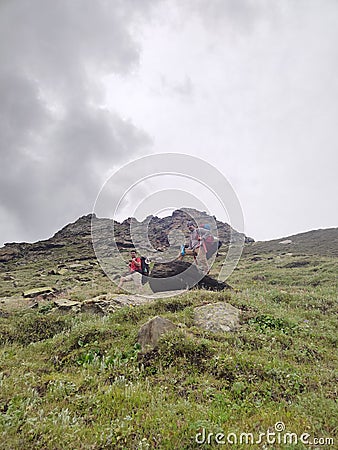 Himachal, India - July 10th, 2022 : Man with trekking bag in the mountain, summer hike with backpacks, himalayan view Editorial Stock Photo