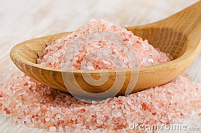 Himalayan pink salt in wooden spoon Stock Photo