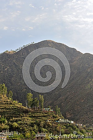 Himalayan village situated on cliffs of mountain Stock Photo