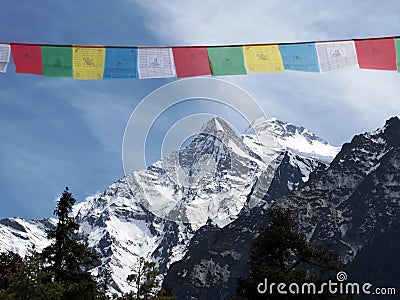 Himalayans prayer flags close to the mountains Stock Photo