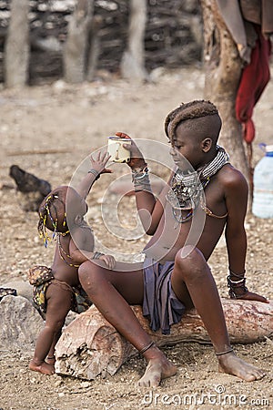 Himba girl and baby Editorial Stock Photo