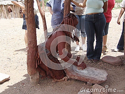 Himba. Native african peolple. Prepare some food Editorial Stock Photo