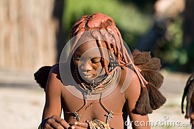 Himba woman looks down, Namibia. Editorial Stock Photo