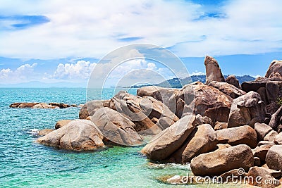 Hin Ta and Hin Yai rocks close up, Grandmother and Grandfather stones on blue sea and sunny cloudy sky background, Samui, Thailand Stock Photo