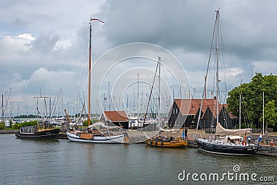 HINDELOOPEN, FRISLAND/THE NETHERLANDS - JULY 2, 2020:Sailing and fishing vessels moored in the port of Hindeloopen Editorial Stock Photo