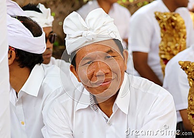 Hindu celebration at Bali Indonesia, religious ceremony with yellow and white colors, woman dancing. Editorial Stock Photo