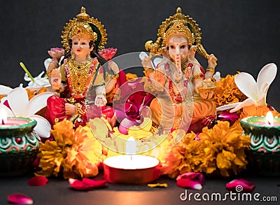 Hindu God Laxmi Ganesh with Candle Light at Diwali Festival Stock Photo