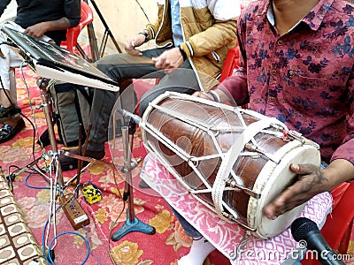 Hindu man play drums,a musical instrument in a religious gathering Editorial Stock Photo