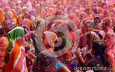 Hindu men and women celebrating Holi festival Editorial Stock Photo
