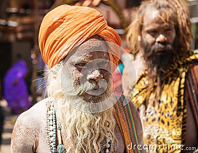 A Hindu naga sadhu Naked holy men rubbed with ashes during Kumbha Mela Editorial Stock Photo
