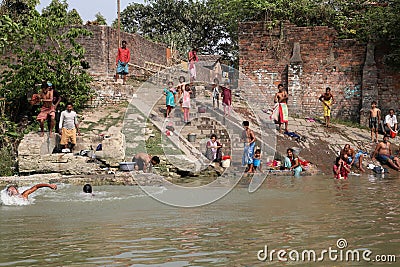 Hindu people bathing in the ghat near the Dakshineswar Kali Temple in Kolkata Editorial Stock Photo