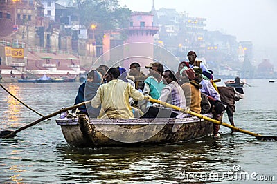 Hindu people in a boat on river Editorial Stock Photo