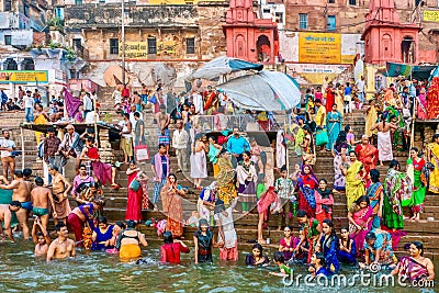 Hindu pilgrims bathing on the ghats of Varanasi, India. Editorial Stock Photo
