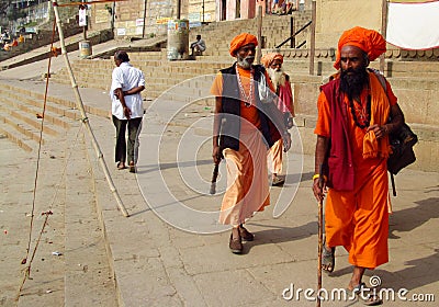Hindu piligrim sadhu in orange clothes on the streets in India Editorial Stock Photo
