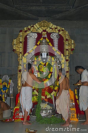 Hindu priest with Lord Venkatesa Editorial Stock Photo