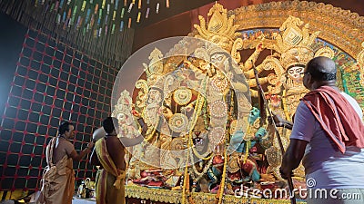Hindu Purohits worshipping Goddess Durga with puja ingredients Editorial Stock Photo