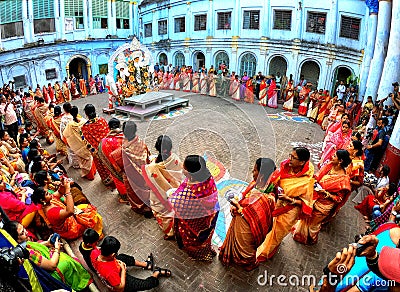 Hindu women dancing around Durga Devi idol Editorial Stock Photo