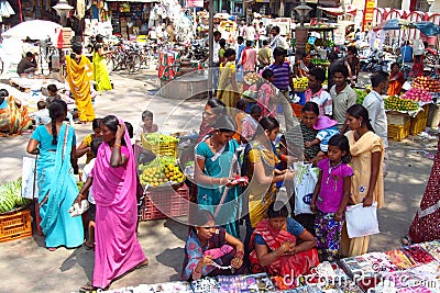 Hindu women dressed in colorful sari in Indian street market Editorial Stock Photo