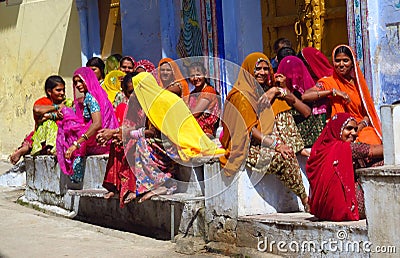 Hindu women dressed in colorful sari in Indian street market Editorial Stock Photo