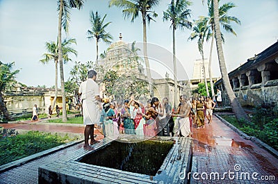 Hindus are washed from the sacred well Editorial Stock Photo