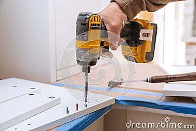 Hinge drawers assembly on assembling flat pack furniture Stock Photo