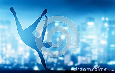 Hip hop, break dance performed by young man in city lights Stock Photo