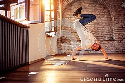 Hip hop lifestyle concept - street artist break dancing performing moves Stock Photo
