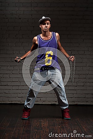 Hip-hop style man holding chain Stock Photo